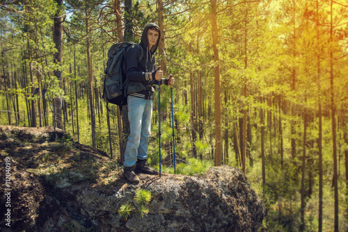Hiker walking in a mountain forest