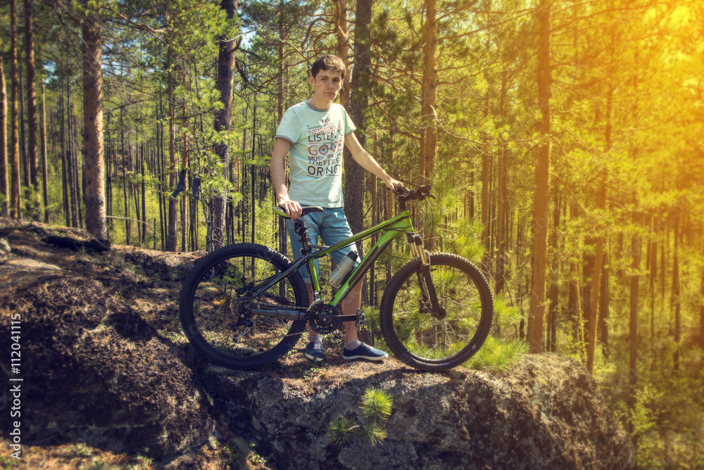 biker with bike on the rocks. Sport, adventure, motivation. biker with bike on the rocks. Sport, adventure, motivation.