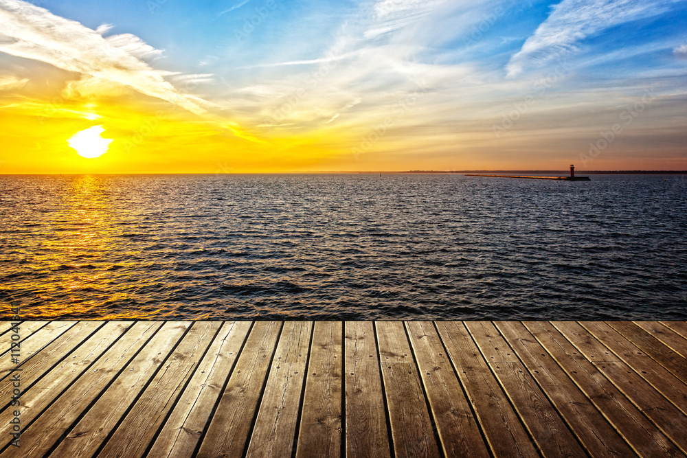 Sunset background with empty plank and sea.
