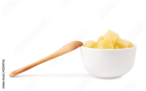 Pile of canned pineapple over isolated white background