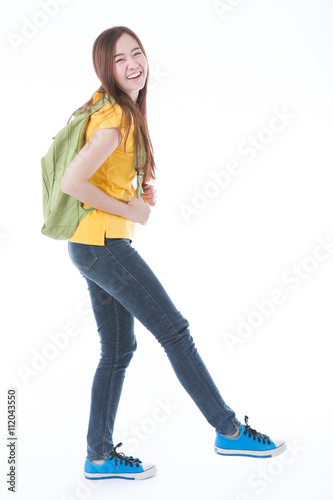 Young asian student girl with book. Isolated on white background