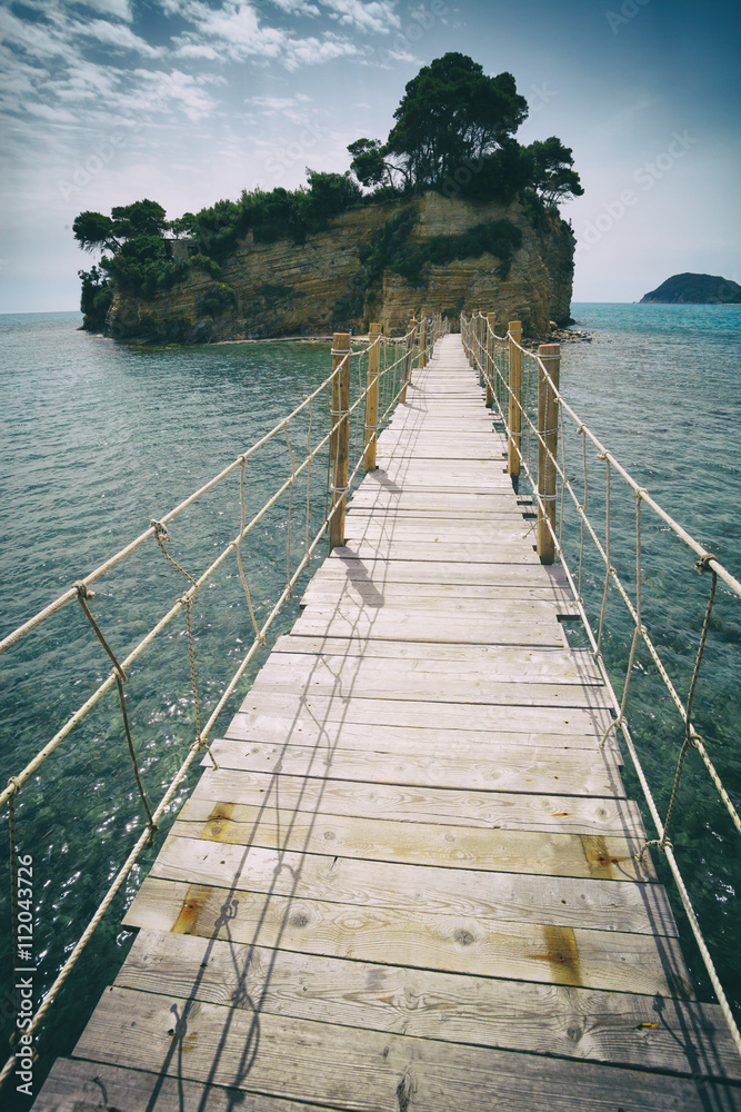 Hanging wooden bridge over the sea Cameo Island Zakynthos Greece