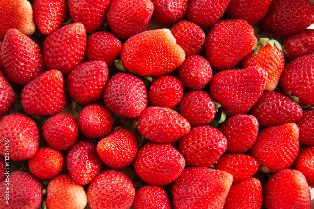 background from freshly harvested strawberries background from freshly harvested strawberries
