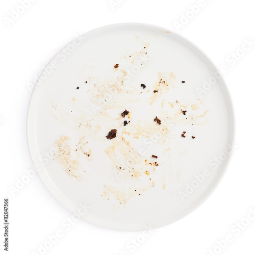 Dirty big plate over white isolated background
