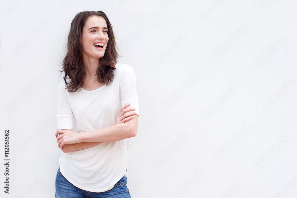 Beautiful woman laughing against white wall Beautiful woman laughing against white wall