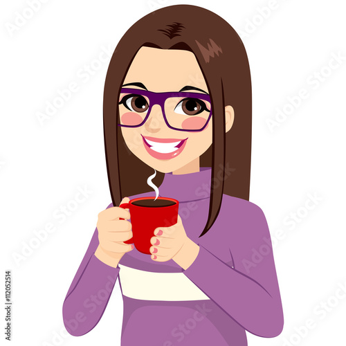 Beautiful young brunette woman drinking hot chocolate