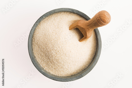 Bowl of semolina isolated on white