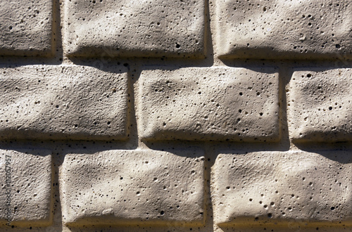 Beige brick stylized wall texture.