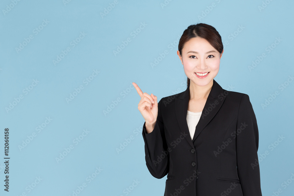 portrait of asian businesswoman isolated on blue background portrait of asian businesswoman isolated on blue background