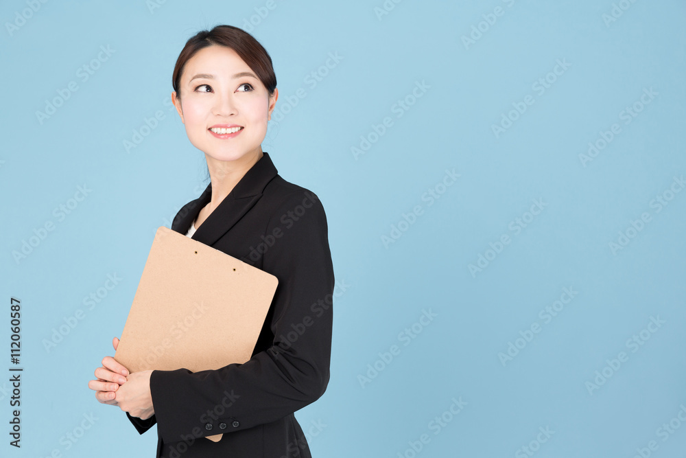portrait of asian businesswoman isolated on blue background portrait of asian businesswoman isolated on blue background