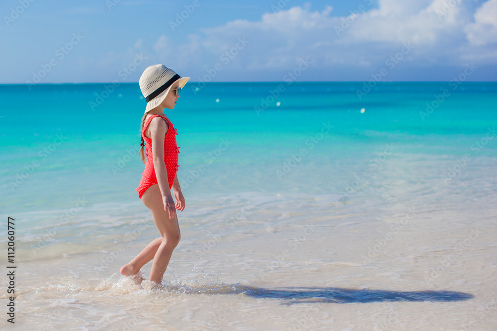 Adorable little girl on beach vacation having fun Adorable little girl on beach vacation having fun
