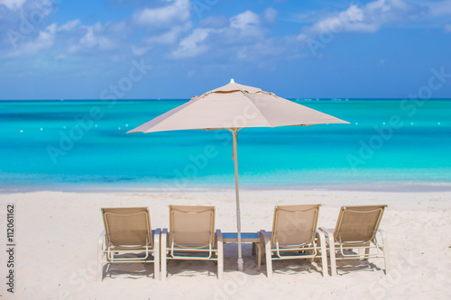 Fototapeta Naklejka Na Ścianę i Meble -  Beach chairs on exotic tropical white sandy beach