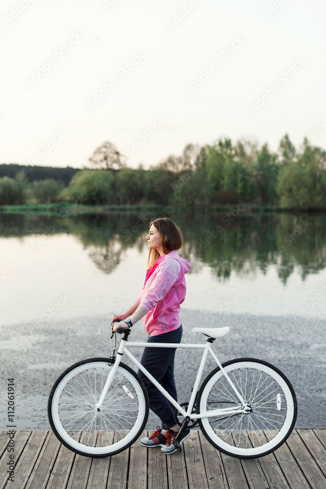 Fototapeta premium Hipster girl with modern bike
