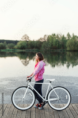 Hipster girl with modern bike