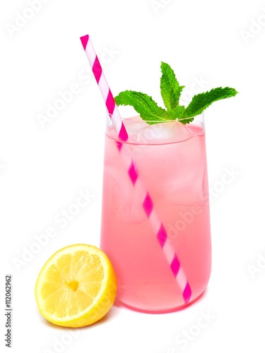 Glass of summer pink lemonade with mint and straw isolated on a white background