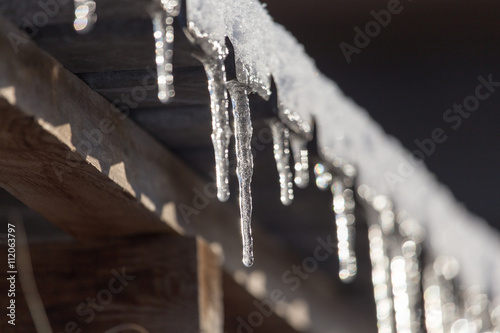 Long and dangerous icicles on a house roof
