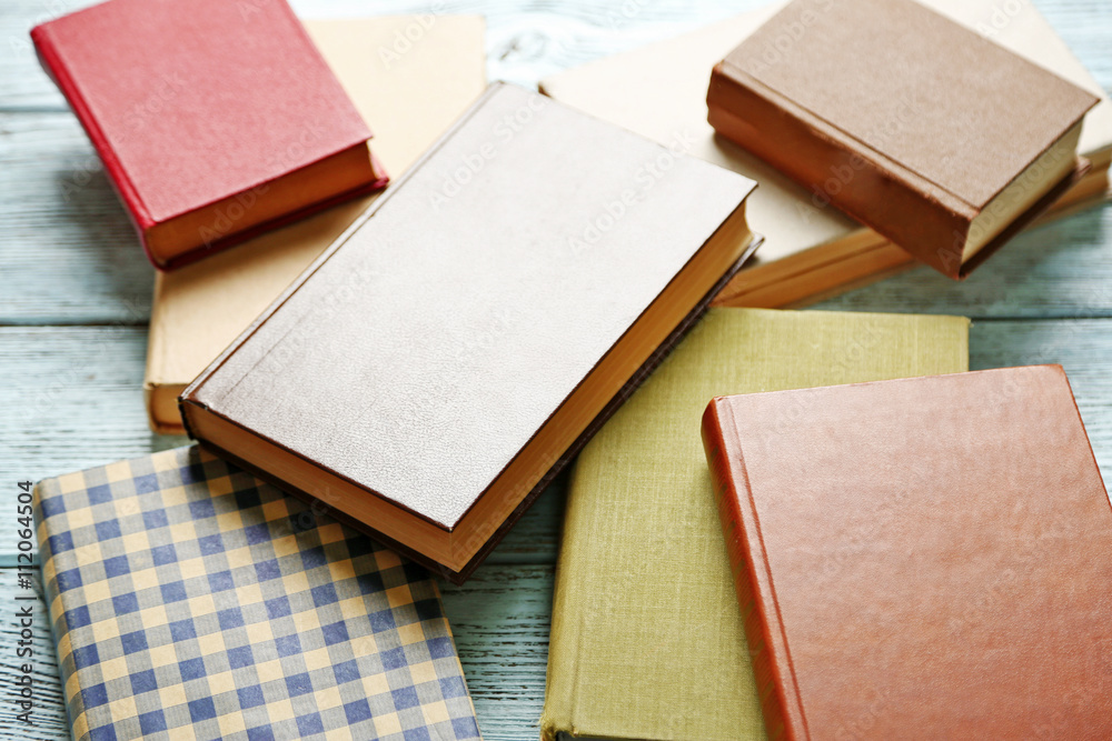 Fototapeta premium Pile of books on wooden background