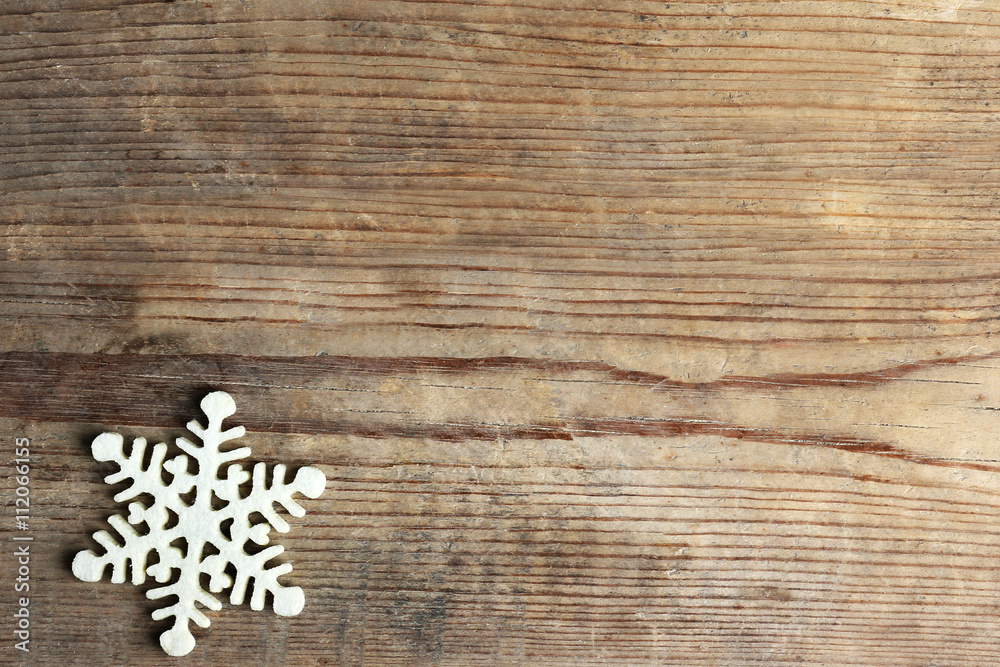Winter background with snowflake on wooden background Winter background with snowflake on wooden background