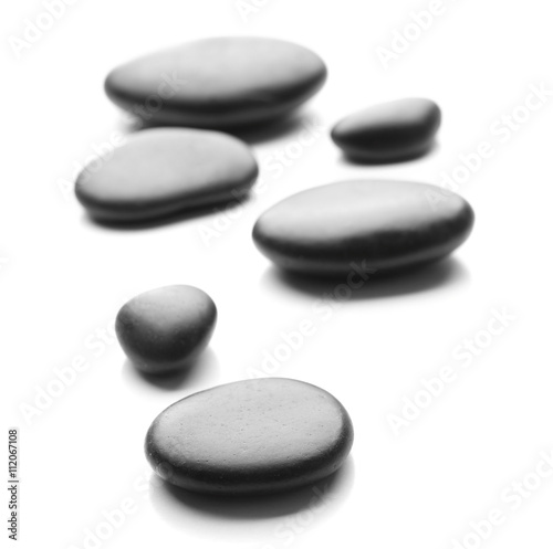 Heap of spa hot stones isolated on white