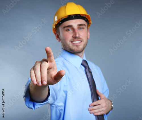 Man in helmet making sign w...