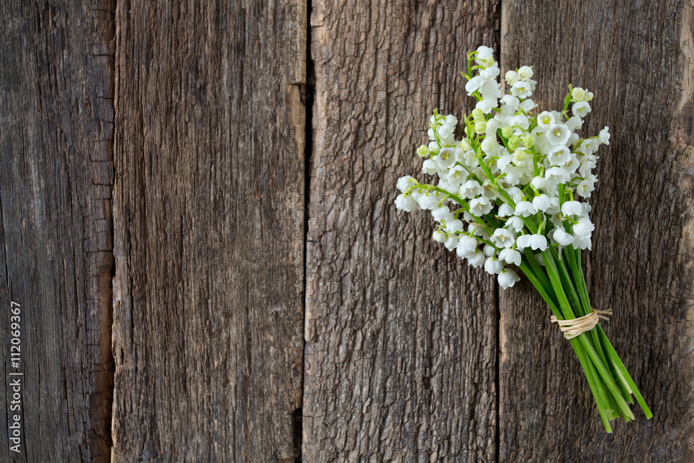 lilies of the valley on the wooden surface lilies of the valley on the wooden surface