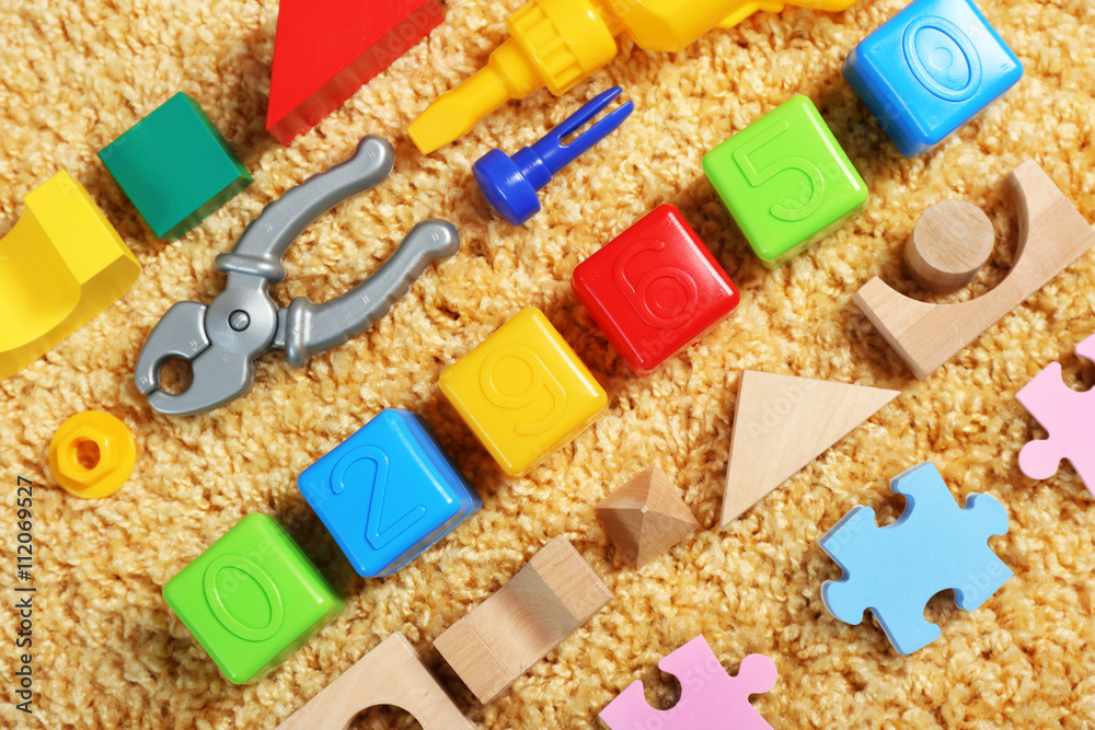 Colorful kids toys on carpet Colorful kids toys on carpet