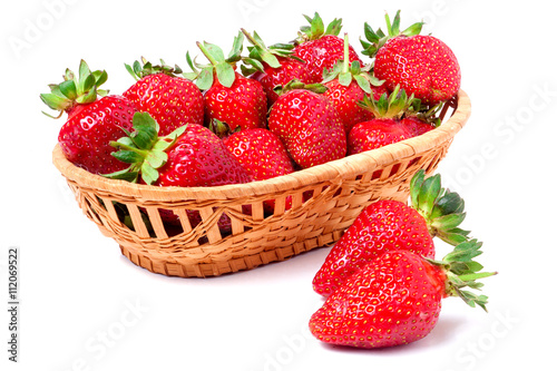 strawberries in a wicker basket isolated on white background