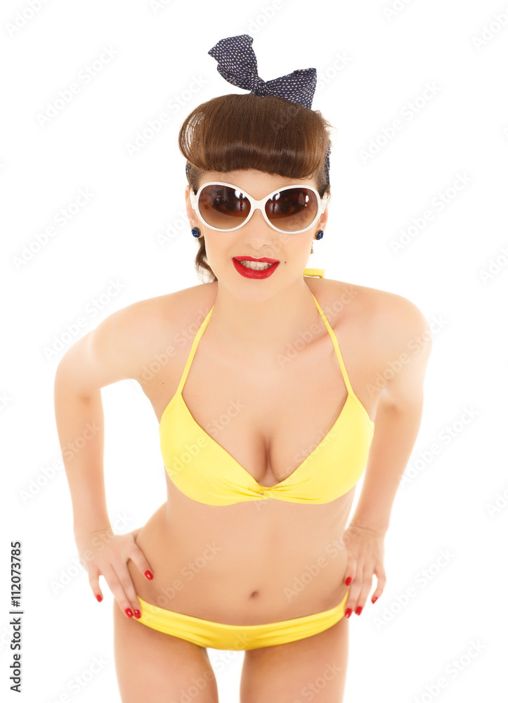 Woman in bikini with sunglasses.