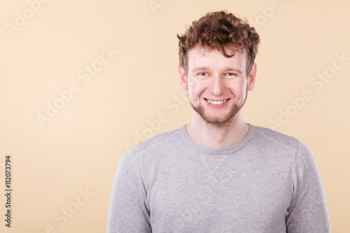 Blonde smiling man portrait.