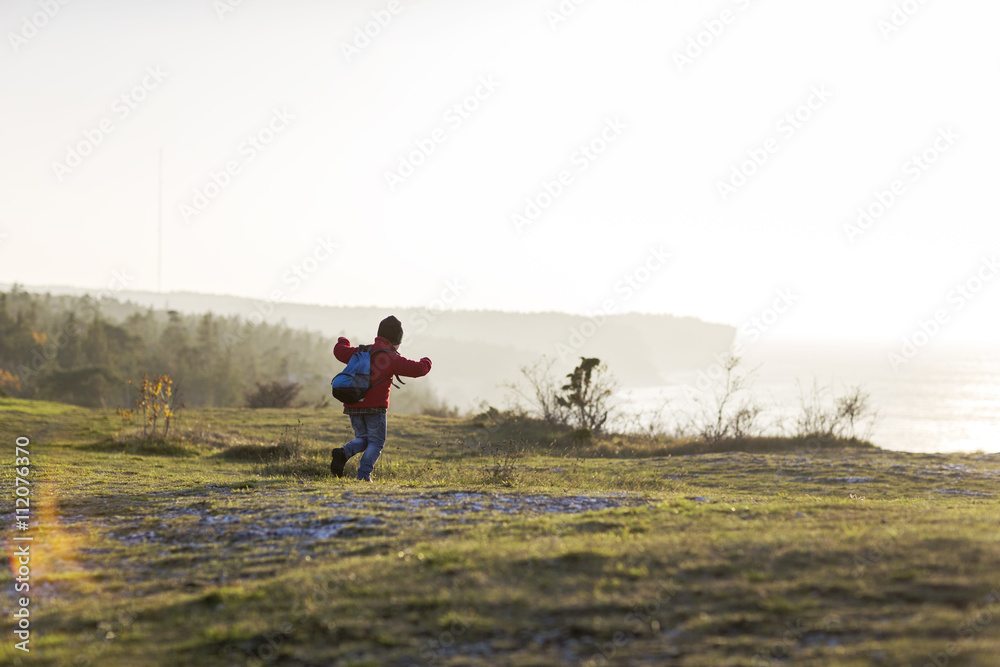 Boy running on meadow Boy running on meadow