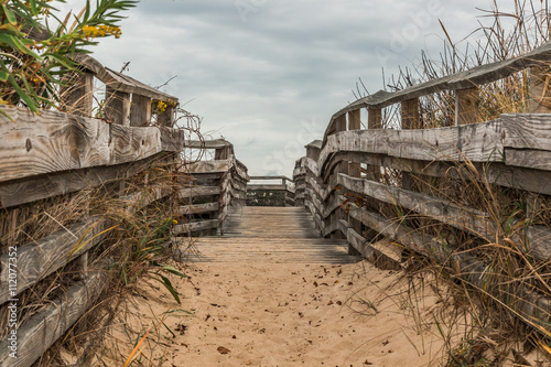 Sand-covered pathway to beach at First Landing State Park in Virginia Beach, Virginia. 