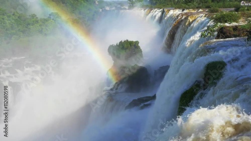 Rainbow at Iguazu Falls, on the border of Argentina and Brazil - zoom out. photo