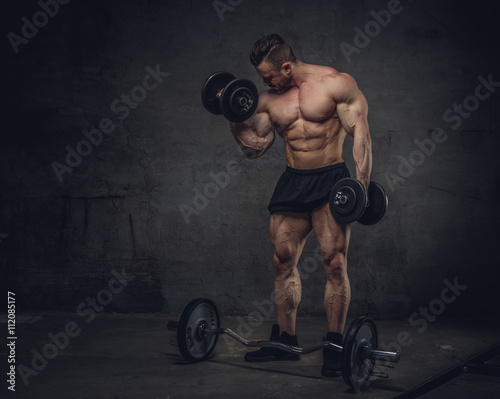 BPortrait of bodybuilder with dumbbells photo