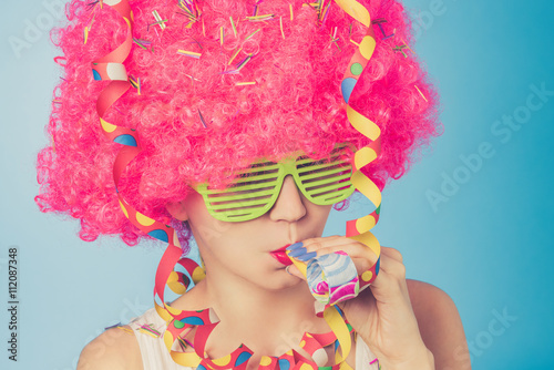 Portrait of beautiful woman in pink wig and green glasses