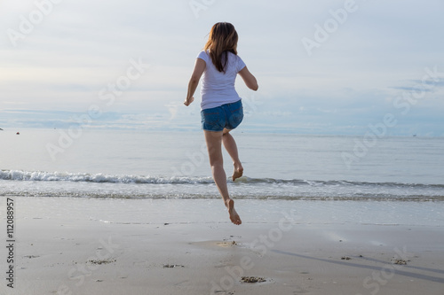 woman jumping at seaside