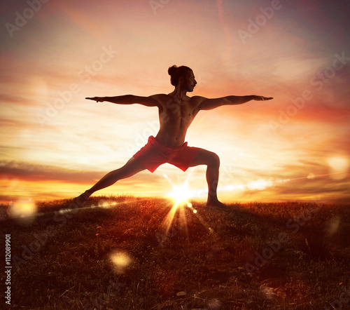 Fototapeta Naklejka Na Ścianę i Meble -  Yoga at sunset