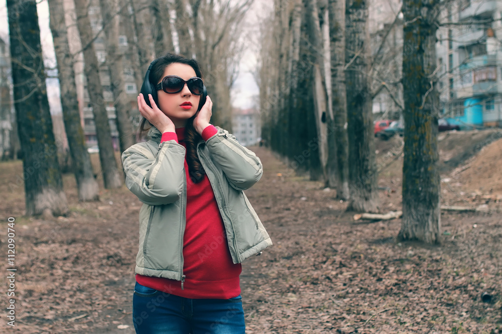 girl in park with headphone girl in park with headphone