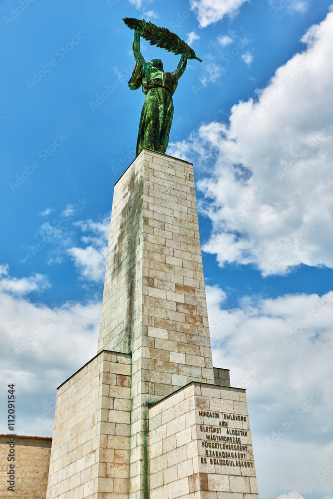 Statue of Liberty on Gellert hill in Budapest at summer day.
