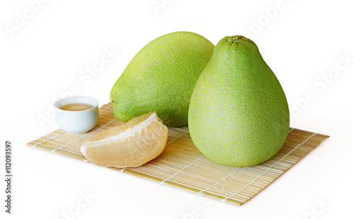 Fresh juicy pomelo fruit isolated on white background