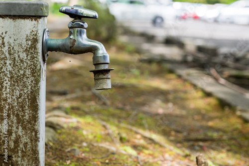 Outdoor Old rusty cast iron faucet