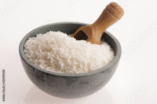 Coconut flakes in ceramic bowl