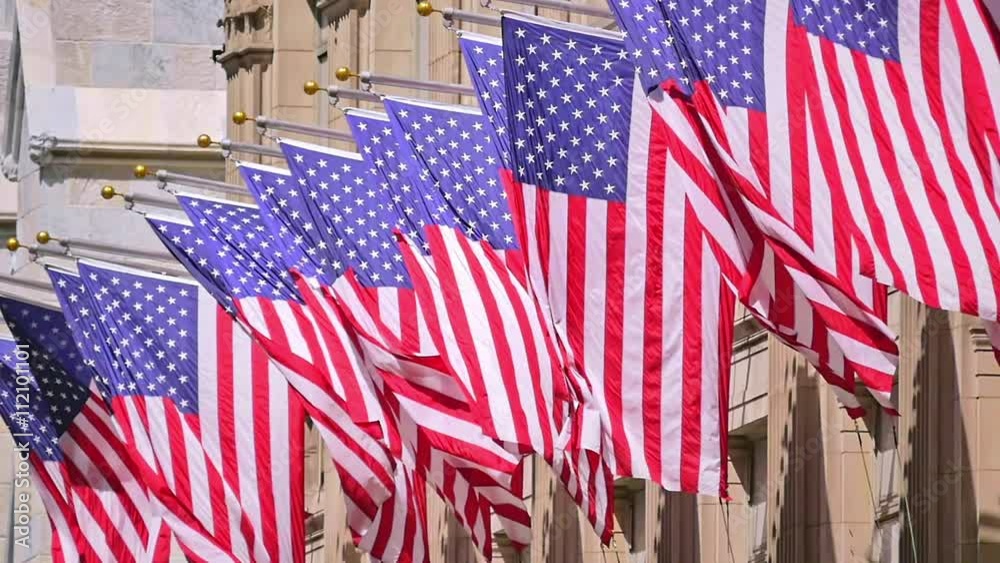 USA United States flags facade waving slow motion sunny day