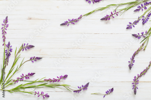 Fototapeta Naklejka Na Ścianę i Meble -  flowers on white wooden background