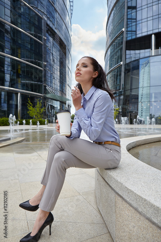 Businesswoman holding a cup of coffee