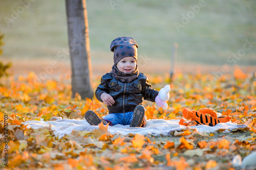 Baby sitting in the park. photo