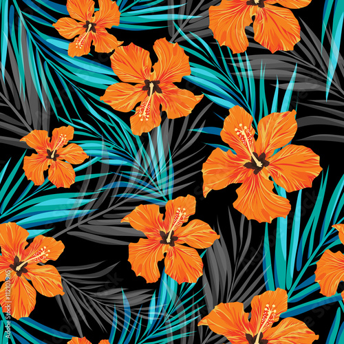 Summer tropical hawaiian background with palm tree leaves and exotic flowers