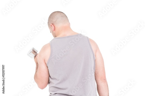 Athlete working out with dumbbells on white background