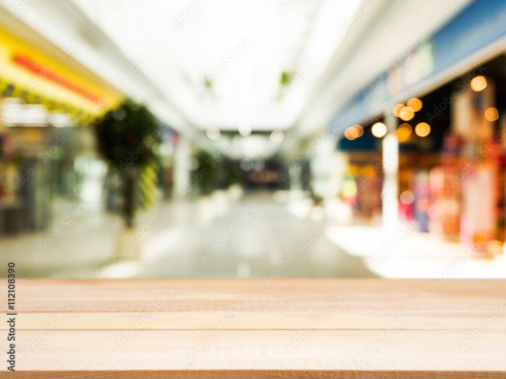 Wooden empty table in front of blurred background