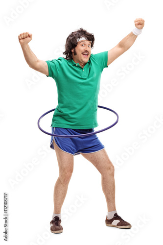 Retro guy exercising with a hula hoop photo