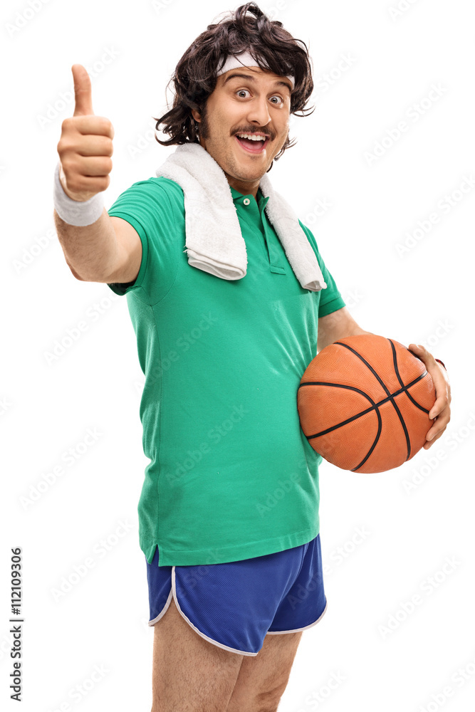 Fototapeta premium Retro guy holding a basketball and thumb up